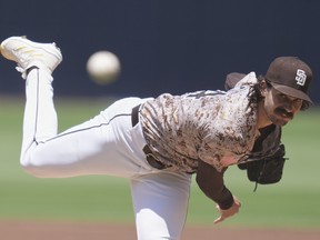 San Diego Padres starting pitcher Dylan Cease works against a Boston Red Sox batter during a game earlier this year.
