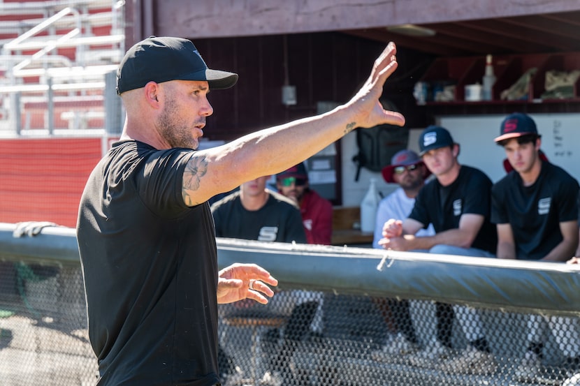 Texas Rangers Manager Skip Schumaker speaks to players at Saddleback College on Wednesday,...