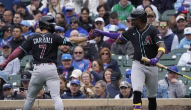 Apr 19, 2025; Chicago, Illinois, USA; Arizona Diamondbacks outfielder Corbin Carroll (7) is greeted by shortstop Geraldo Perdomo (2) after hitting a home run against the Chicago Cubs during the first inning at Wrigley Field. Mandatory Credit: David Banks-Imagn Images