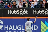 Texas Rangers pitcher Jacob deGrom (48) tips his cap to the crowd after a tribute video was...