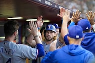 Texas Rangers right fielder Travis Jankowski celebrates with pitcher Andrew Heaney and...