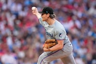 Miami Marlins' Declan Cronin pitches during the sixth inning of a baseball game against the...
