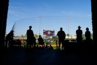 Fans watch during the ninth inning of a spring training game between the Athletics and the...