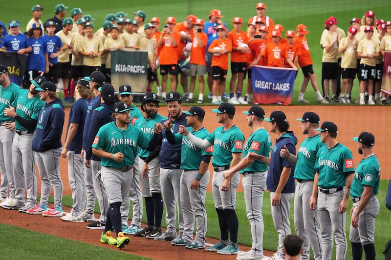 Seattle Mariners first base Josh Naylor is introduced before the Little League Classic baseball game against the New York Mets at Bowman Field in Williamsport, Pa., Sunday, Aug. 17, 2025. (AP Photo/Gene J. Puskar)