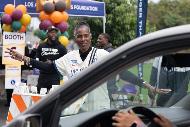 Brotherhood Crusade’s Executive Vice President Stacy Hill-Williams directs traffic during...