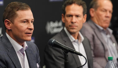Walker Monfort, left, executive vice president of the Colorado Rockies, responds to a question as Paul DePodesta, the team