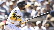 Sep 24, 2025; San Diego, California, USA; San Diego Padres first baseman Luis Arraez (4) hits a single during the first inning against the Milwaukee Brewers at Petco Park. Mandatory Credit: Denis Poroy-Imagn Images