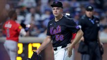 Aug 14, 2025; New York City, New York, USA; New York Mets relief pitcher Ryan Helsley (56) reacts as he walks off the field after the top of the eighth inning against the Atlanta Braves at Citi Field. Mandatory Credit: Brad Penner-Imagn Images