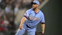 Aug 24, 2025; Arlington, Texas, USA; Texas Rangers starting pitcher Merrill Kelly (23) pitches against the Cleveland Guardians during the first inning at Globe Life Field. Mandatory Credit: Jerome Miron-Imagn Images