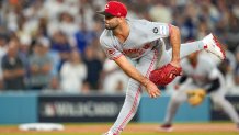 Cincinnati Reds starting pitcher Nick Martinez (28) throws a pitch in relief in the sixth inning of the MLB National League Wild Card Game 2 between the Los Angeles Dodgers and the Cincinnati Reds at Dodger Stadium in Los Angeles on Wednesday, Oct. 1, 2025. The Reds were eliminated from the postseason with an 8-4 loss to the reining World Series Champions La Dodgers.