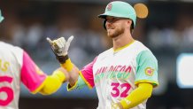 Aug 22, 2025; San Diego, California, USA; San Diego Padres designated hitter Ryan O'Hearn (32) celebrates with the dugout after hitting a single during the second inning against the Los Angeles Dodgers at Petco Park. Mandatory Credit: David Frerker-Imagn Images
