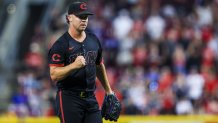 Sep 19, 2025; Cincinnati, Ohio, USA; Cincinnati Reds relief pitcher Emilio Pagan (15) reacts after the victory over the Chicago Cubs at Great American Ball Park. Mandatory Credit: Katie Stratman-Imagn Images