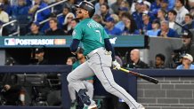 Oct 13, 2025; Toronto, Ontario, CAN; Seattle Mariners second baseman Jorge Polanco (7) hits a three run home run against the Toronto Blue Jays in the fifth inning during game two of the ALCS round for the 2025 MLB playoffs at Rogers Centre. Mandatory Credit: Dan Hamilton-Imagn Images