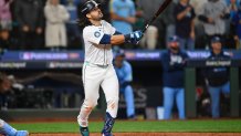 Oct 17, 2025; Seattle, Washington, USA; Seattle Mariners third baseman Eugenio Suarez (28) hits a grand slam against the Toronto Blue Jays during the eighth inning during game five of the ALCS round for the 2025 MLB playoffs at T-Mobile Park. Mandatory Credit: Steven Bisig-Imagn Images