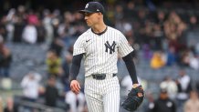 May 22, 2025; Bronx, New York, USA; New York Yankees relief pitcher Luke Weaver (30) reacts after closing the game against the Texas Rangers at Yankee Stadium. Mandatory Credit: Vincent Carchietta-Imagn Images