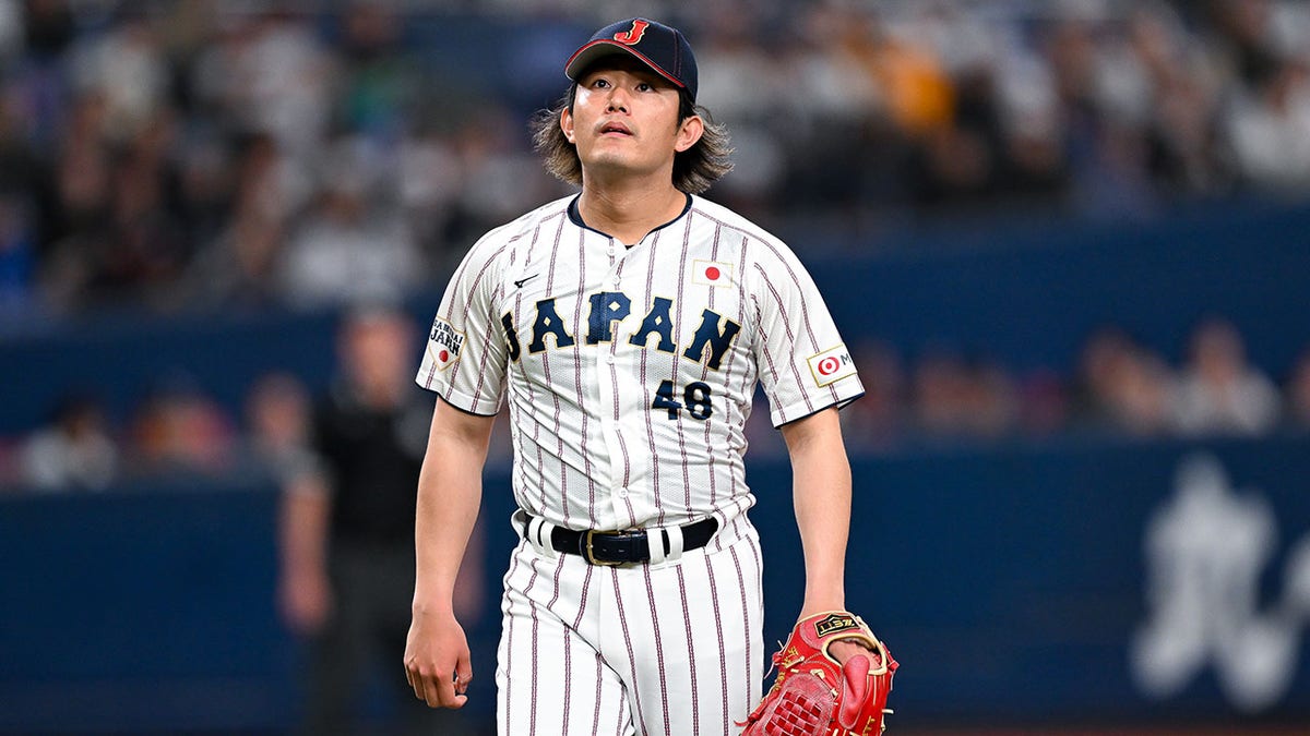 Tatsuya Imai reacts during a baseball game