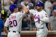 New York Mets' Brandon Nimmo (9) celebrates with Pete Alonso (20) after hitting a three-run...