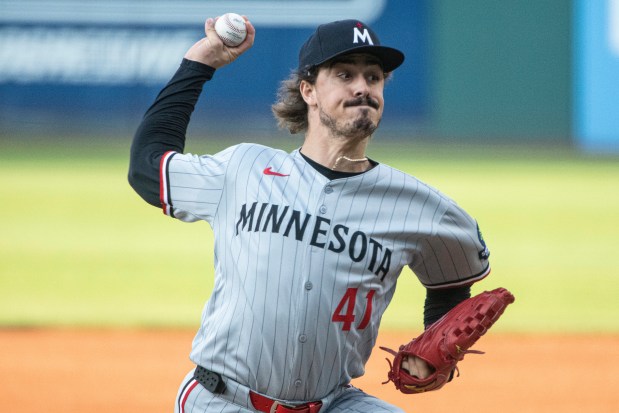 Minnesota Twins starting pitcher Joe Ryan delivers against the Cleveland Guardians during the first inning of a game, Friday, Aug. 1 in Cleveland. (AP Photo/Phil Long)