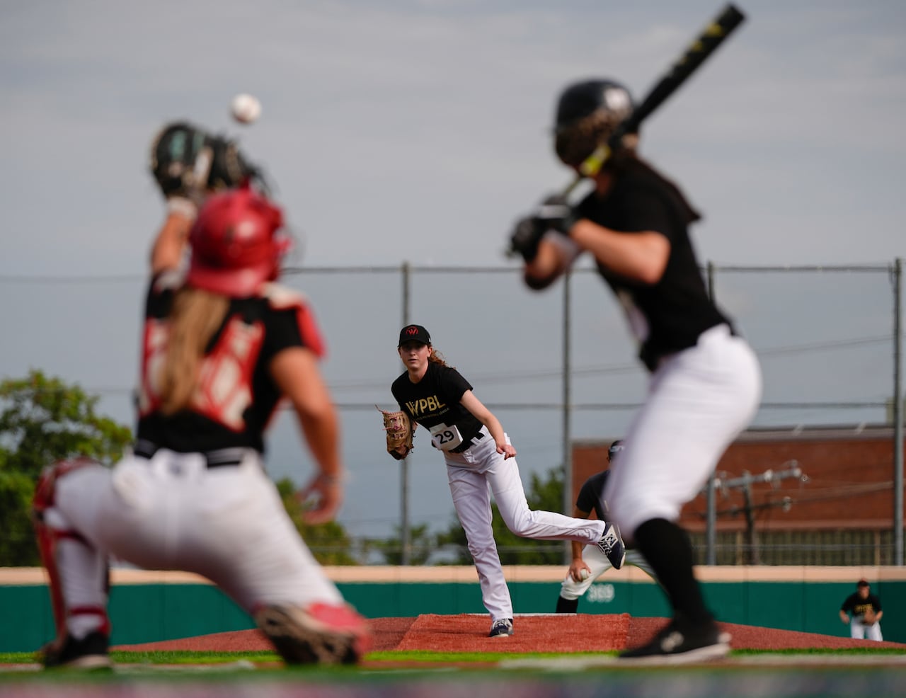 A player pitches a ball during a baseball game.