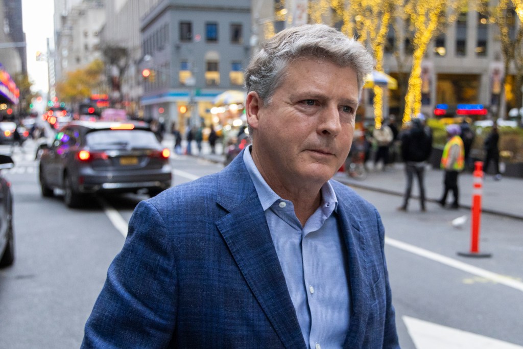 New York Yankees owner Hal Steinbrenner leaves the MLB owner's meeting earlier this month.