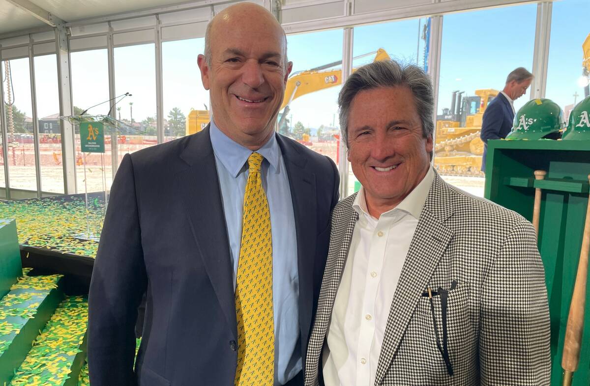 MGM Resorts International President and CEO Bill Hornbuckle is shown with Athletics owner John ...