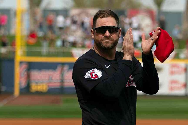FILE - Cleveland Guardians manager Stephen Vogt turns to acknowledge veterans before the start of a spring training baseball game against the Cincinnati Reds, Feb. 24, 2024, in Goodyear, Ariz. (AP Photo/Carolyn Kaster, File)