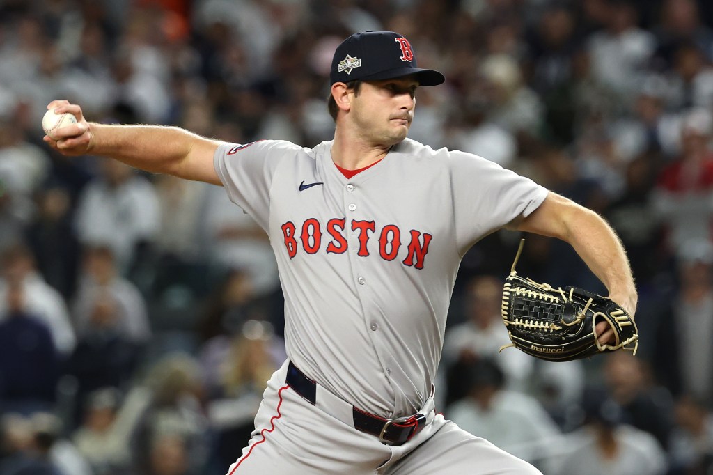 Boston Red Sox pitcher Garrett Whitlock in the middle of a pitch.