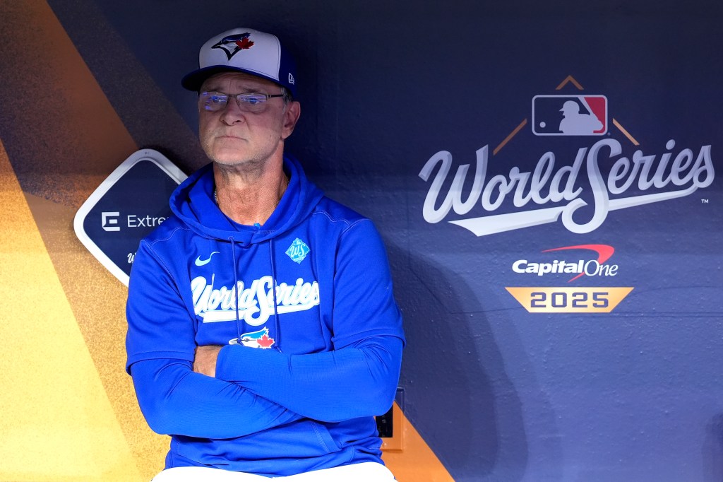 Manager in a Toronto Blue Jays baseball cap and World Series hoodie.