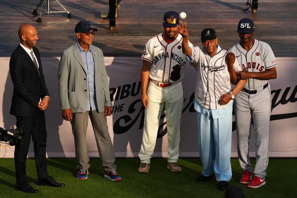 Derek Jeter, Reggie Jackson, LaMonte Wade Jr. and Bill Greason and Willie McGee