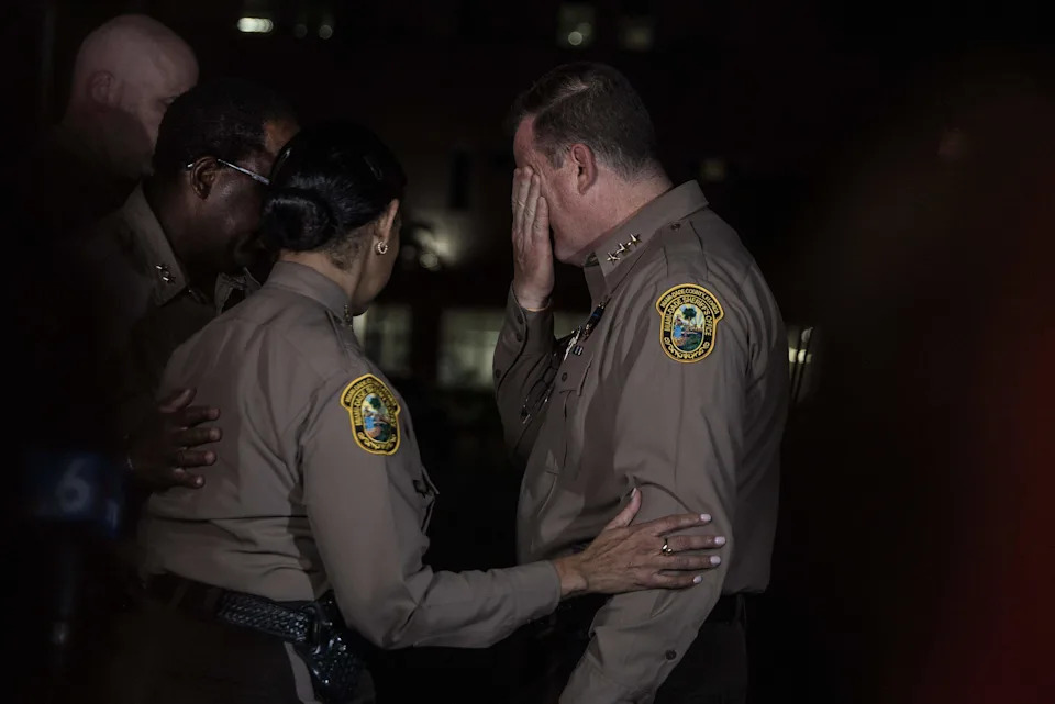 Miami-Dade Sheriff Rosie Cordero-Stutz comforts a member of her Command Staff during a press conference outside of the HCA Florida Kendall Hospital after Miami-Dade Deputy Devin Jaramillo was ambushed as he responded to a traffic accident and was shot to death, on Friday November 07, 2025.