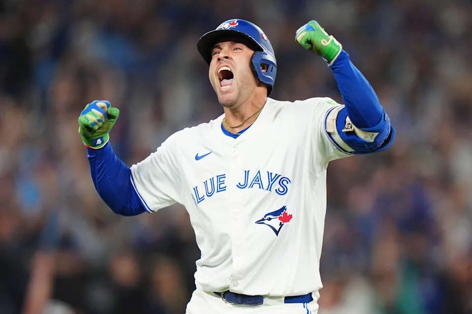 Toronto Blue Jays' George Springer (4) celebrates after hitting a three-run home run against the Seattle Mariners during seventh inning MLB American League Championship Series game 7 baseball action in Toronto, Monday, Oct. 20, 2025. THE CANADIAN PRESS/Frank Gunn
