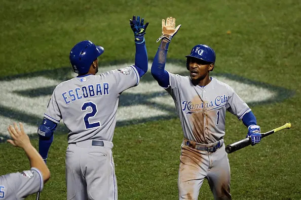 NEW YORK, NY – NOVEMBER 01: Jarrod Dyson #1 of the Kansas City Royals celebrates with Alcides Escobar #2 after scoring the go ahead run hit by Christian Colon #24 in the twelfth inning against Addison Reed #43 of the New York Mets during Game Five of the 2015 World Series at Citi Field on November 1, 2015 in the Flushing neighborhood of the Queens borough of New York City. (Photo by Doug Pensinger/Getty Images)