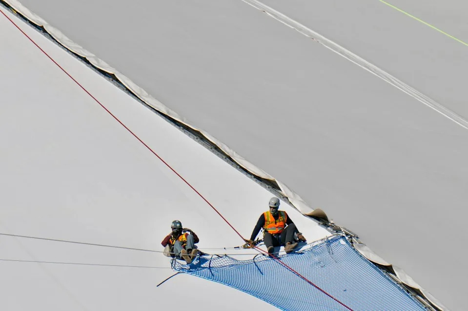 Workers repair the panels on the roof of Tropicana Field on Nov. 3, 2025, in St. Petersburg, Fla. The roof was destroyed by Hurricane Milton in 2024. AP