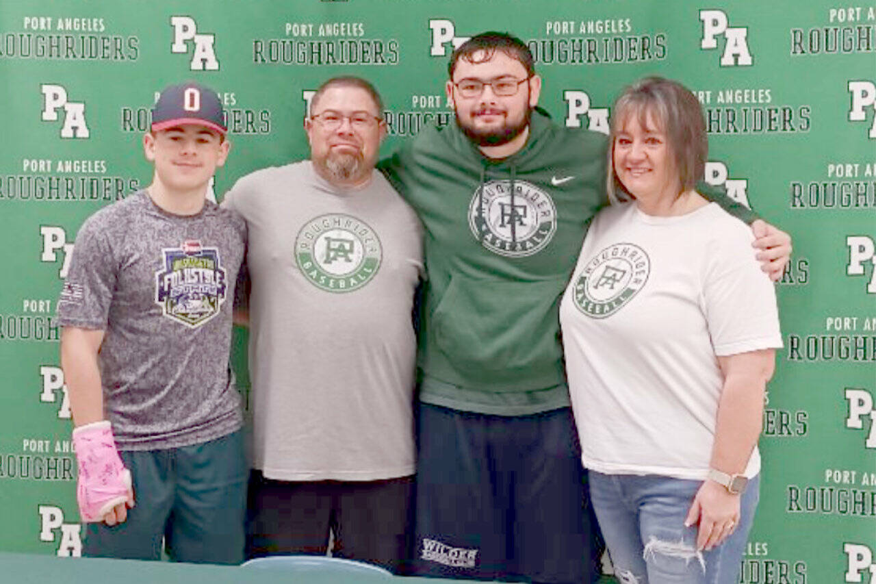 Kody Williams poses with his family after signing a commitment to play baseball for Skagit Valley College in Mount Vernon. From left are brother Kyler Williams, father Josh Williams, Kody and mother Jenny Williams. (Pierre LaBossiere/Peninsula Daily News)