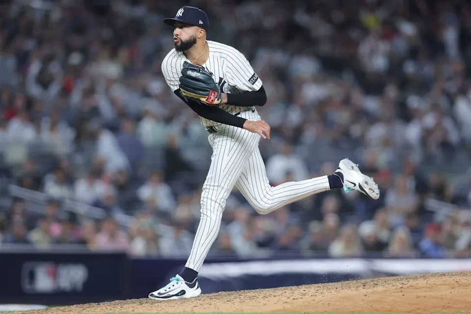 Oct 1, 2025; Bronx, New York, USA; New York Yankees relief pitcher Devin Williams (38) pitches during the eighth inning against the Boston Red Sox during game two of the Wildcard round for the 2025 MLB playoffs at Yankee Stadium. Mandatory Credit: Brad Penner-Imagn Images