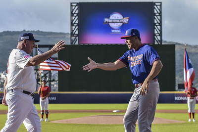 Puerto Rico's Juan Gonzalez and USA's Mike Scioscia share a handshake before the game at the WBSC Premier12 2024