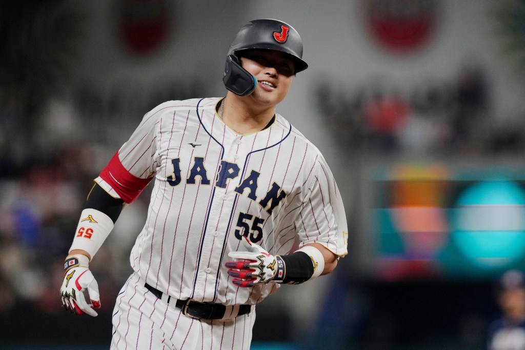 Japan third baseman Munetaka Murakami (55) runs the bases after hitting a home run.