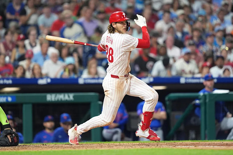 Jun 21, 2025; Philadelphia, Pennsylvania, USA; Philadelphia Phillies infielder Alec Bohm (28) hits an RBI single against the New York Mets in the fifth inning at Citizens Bank Park. Mandatory Credit: Kyle Ross-Imagn Images