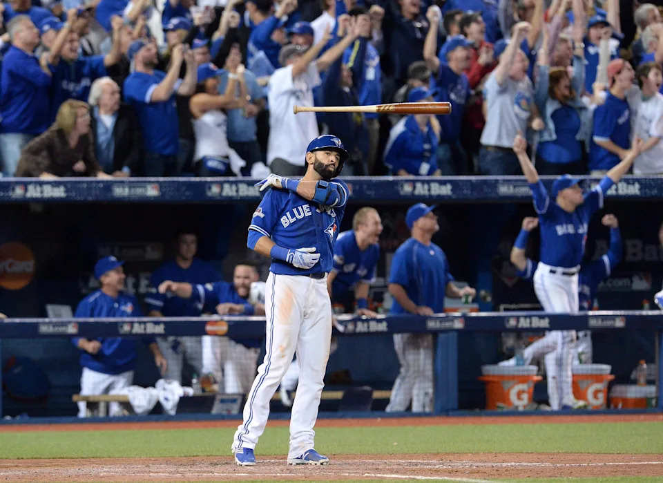 Toronto Blue Jays Jose Bautista flips his bat after hitting a three-run homer during seventh inning game 5 American League Division Series baseball action in Toronto on Wednesday, Oct. 14, 2015. The Toronto Blue Jays was one of the top Canadian subjects of Google searches in 2015. THE CANADIAN PRESS/Chris Young