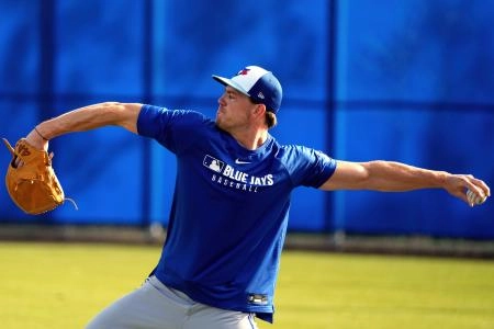 Feb 16, 2025; Dunedin, FL, USA; Toronto Blue Jays pitcher Josh Walker (21) warms up during spring training practice at TD Ballpark. Mandatory Credit: Dave Nelson-Imagn Images