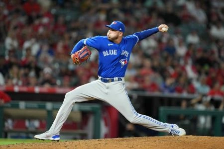 Aug 11, 2021; Anaheim, California, USA; Toronto Blue Jays relief pitcher Tayler Saucedo (54) delivers a pitch in the seventh inning against the Los Angeles Angels at Angel Stadium. Mandatory Credit: Kirby Lee-Imagn Images