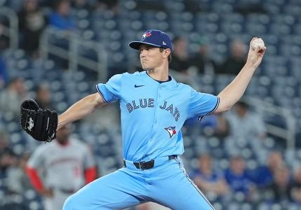 Apr 2, 2025; Toronto, Ontario, CAN; Toronto Blue Jays starting pitcher Easton Lucas (62) throws a pitch against the Washington Nationals during the first inning at Rogers Centre. Mandatory Credit: Nick Turchiaro-Imagn Images