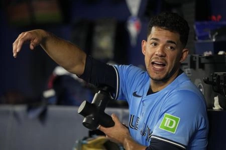 May 29, 2025; Toronto, Ontario, CAN; Toronto Blue Jays starting pitcher Jose Berrios (17) massages his pitching arm during the second inning against the Athletics at Rogers Centre. Mandatory Credit: John E. Sokolowski-Imagn Images