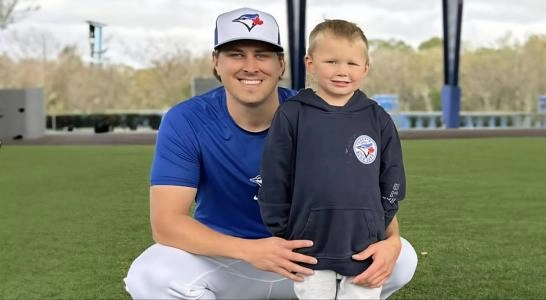 Former Toronto Blue Jays reliever Erik Swanson and his son Toby at the development complex in Dunedin FLA.