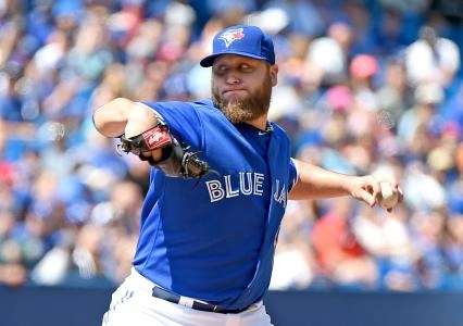 Aug 13, 2015; Toronto, Ontario, CAN; Toronto Blue Jays starting pitcher Mark Buehrle (56) delivers a pitch against Oakland Athletics in the Jays 4-2 win at Rogers Centre. Mandatory Credit: Dan Hamilton-Imagn Images