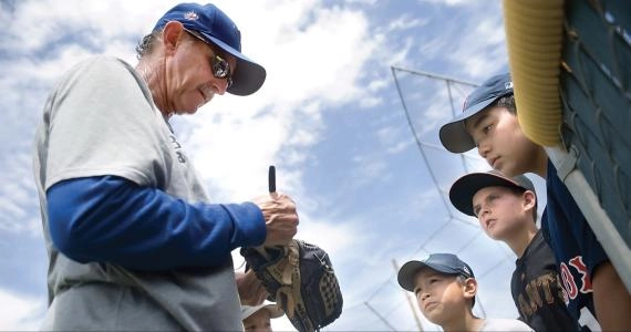 Rance Mulliniks signs autographs for young baseball players in July 2012 at Porterville High School in Porterville, Calif. CREDIT: The Porterville Recorder - Chieko Hara