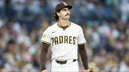 Sep 13, 2025; San Diego, California, USA; San Diego Padres starting pitcher Dylan Cease (84) celebrates in the dugout after coming off the field during the sixth inning against the Colorado Rockies at Petco Park. Mandatory Credit: David Frerker-Imagn Images