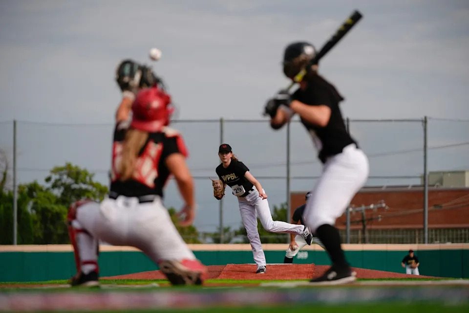 Juliette Kladko, center, pitches during the third day of tryouts for the Women's Professional Baseball League, Sunday, Aug. 24, 2025, at the Washington Nationals Youth Baseball Academy in Washington.