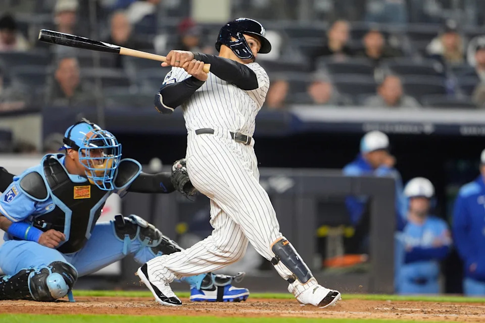 New York Yankees center fielder Trent Grisham (12) hits a home run against the Kansas City Royals during the fifth inning at Yankee Stadium.