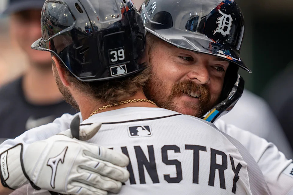 Detroit Tigers catcher Jake Rogers smiles as he hugs Zach McKinstry in the dugout during the game against the Athletics at Comerica Park in Detroit on Thursday, June 26, 2025.